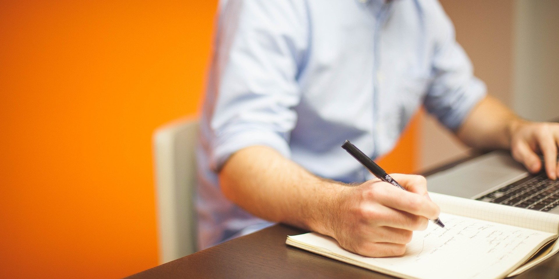 A man writing a business plan format